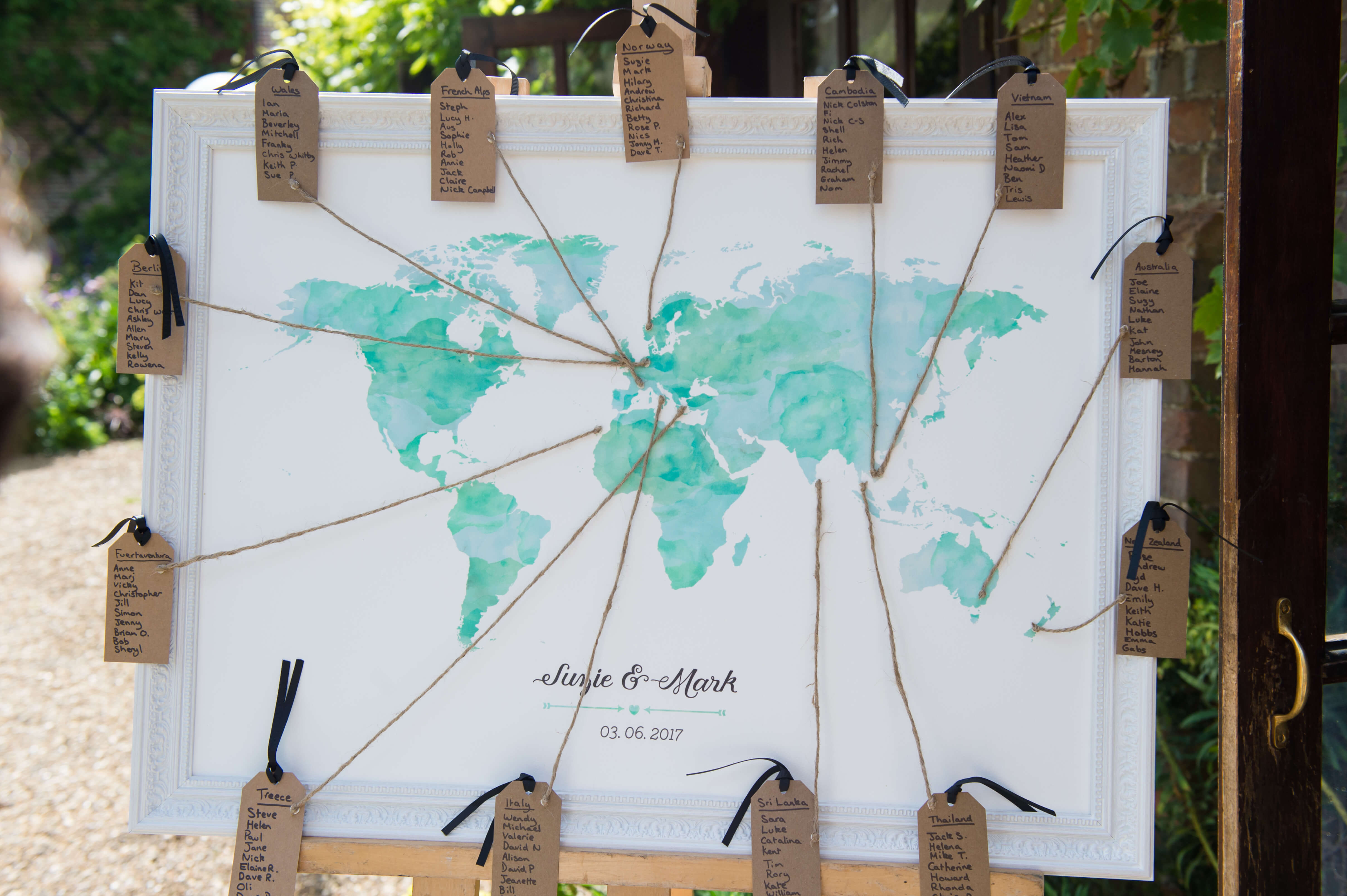 A wedding table plan using a map of the world 